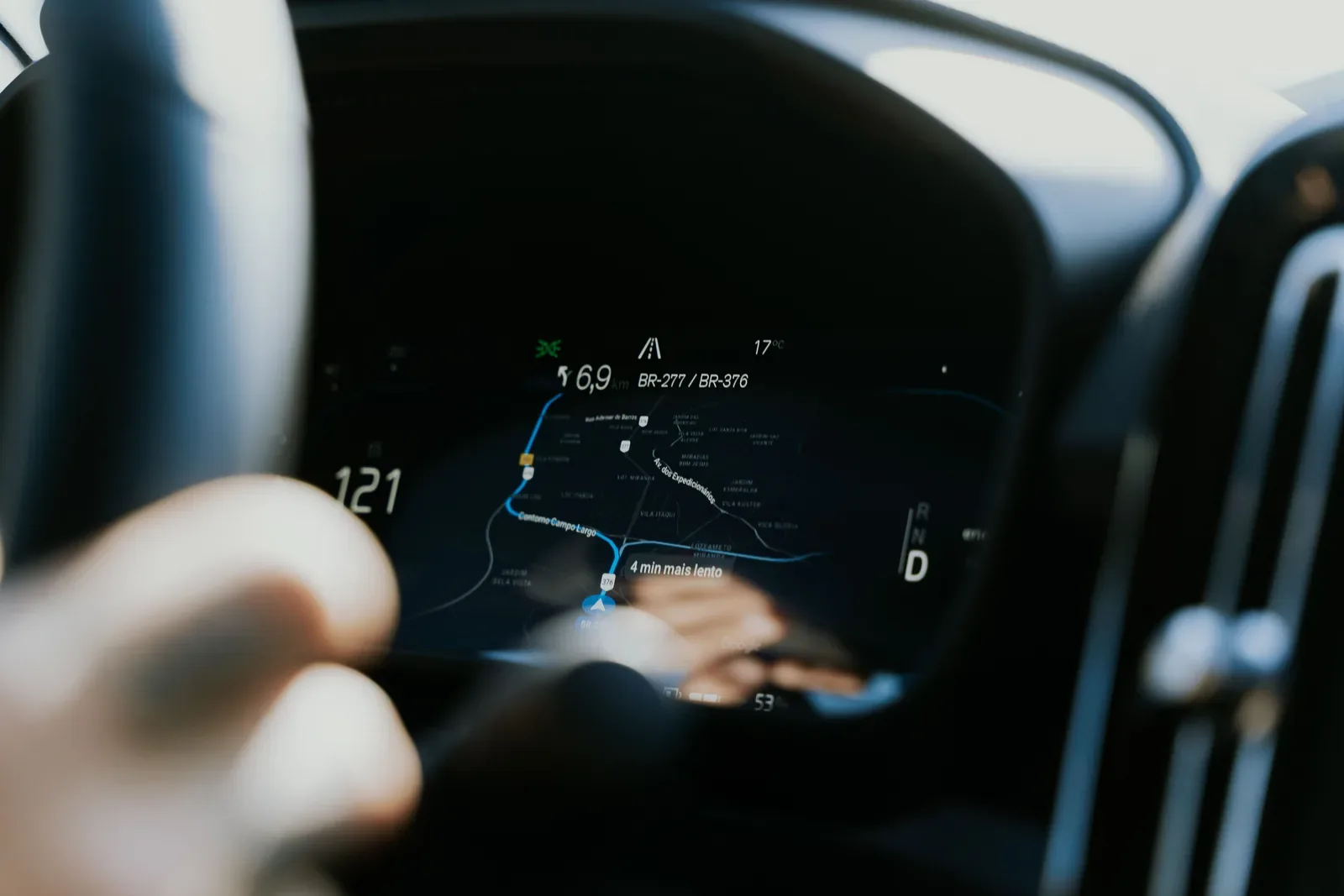 Close-up view of a car dashboard showing a GPS navigation screen in use.